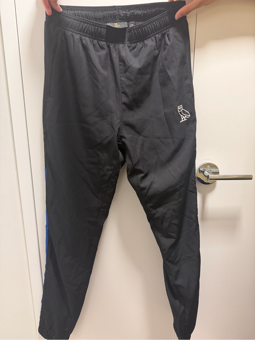 Limited edition OVO Men’s Black Athletic Track Pants with Blue Stripe